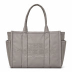 Marc Jacobs | Grey quilted nylon  embossed logo  double handles  exterior pocket  women's commuter tote bag