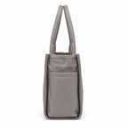 Marc Jacobs | Grey quilted nylon  embossed logo  double handles  exterior pocket  women's commuter tote bag