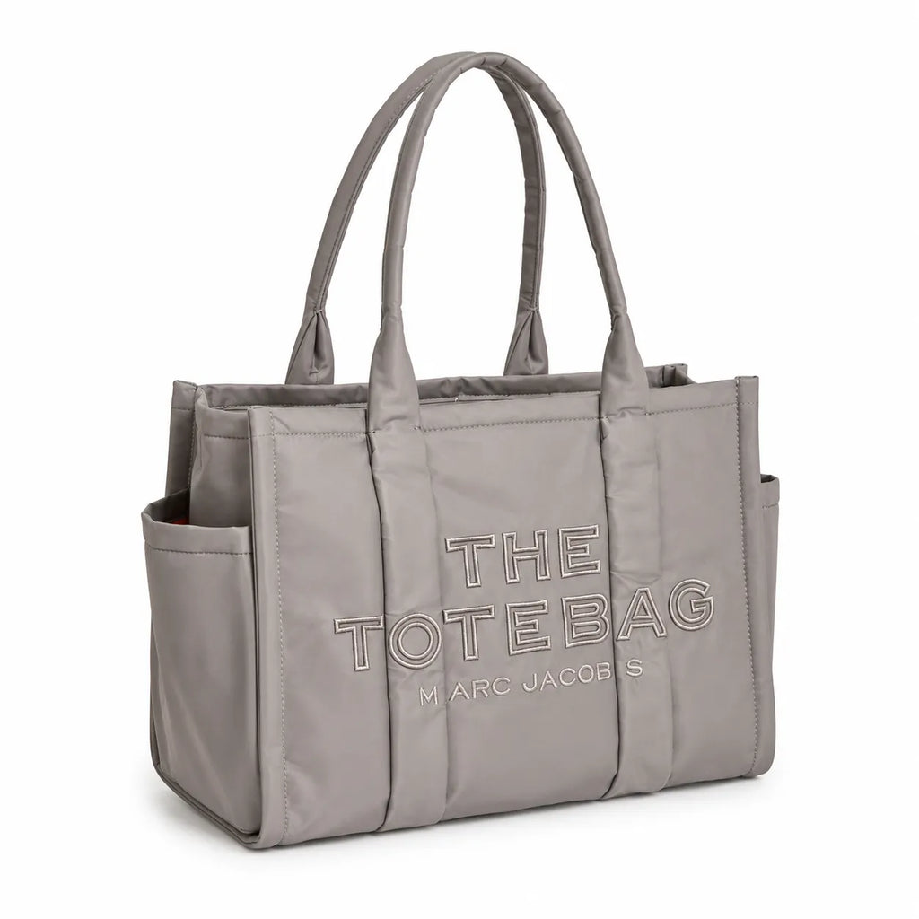 Marc Jacobs | Grey quilted nylon  embossed logo  double handles  exterior pocket  women's commuter tote bag