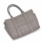 Marc Jacobs | Grey quilted nylon  embossed logo  double handles  exterior pocket  women's commuter tote bag