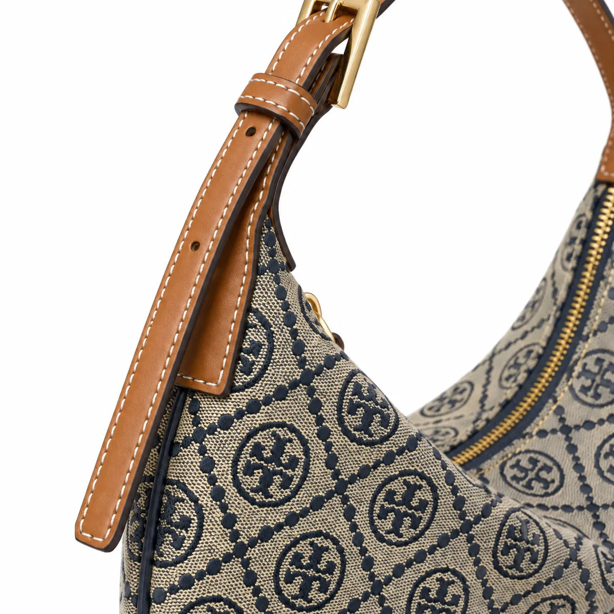 Tory Burch T Monogram Crescent | Beige jacquard fabric with navy blue logo  brown leather trim  adjustable shoulder strap women's designer shoulder bag