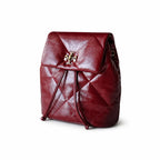Tory Burch Kira Mini Quilted Backpack | Burgundy distressed leather gold double T logo    adjustable chain and leather shoulder strap women's designer backpack
