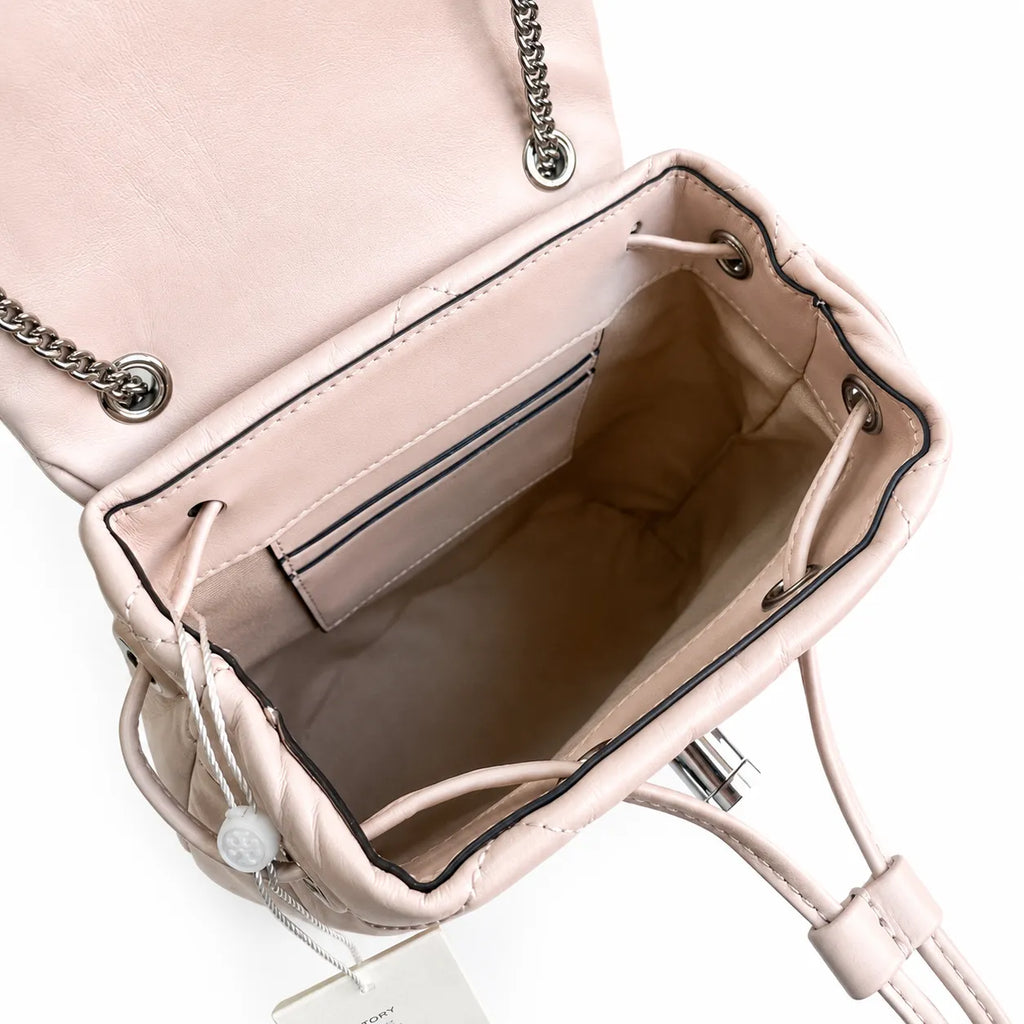Tory Burch Kira Mini Quilted Bag | Soft pink leather with a silver double T logo  featuring an adjustable chain leather shoulder strap  a women's designer backpack