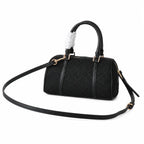 Tory Burch T Monogram | Black embossed canvas with detachable shoulder strap and zip closure  women's designer mini Boston bag