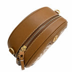 Tory Burch T-pattern round crossbody bag | Beige embossed canvas with brown leather trim detachable shoulder strap