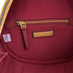Tory Burch T-pattern round crossbody bag | Beige embossed canvas with brown leather trim detachable shoulder strap