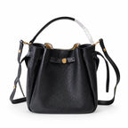 Tory Burch Romy | Black pebbled leather with adjustable shoulder strap and drawstring closure  women's designer shoulder bag