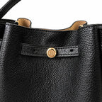 Tory Burch Romy | Black pebbled leather with adjustable shoulder strap and drawstring closure  women's designer shoulder bag