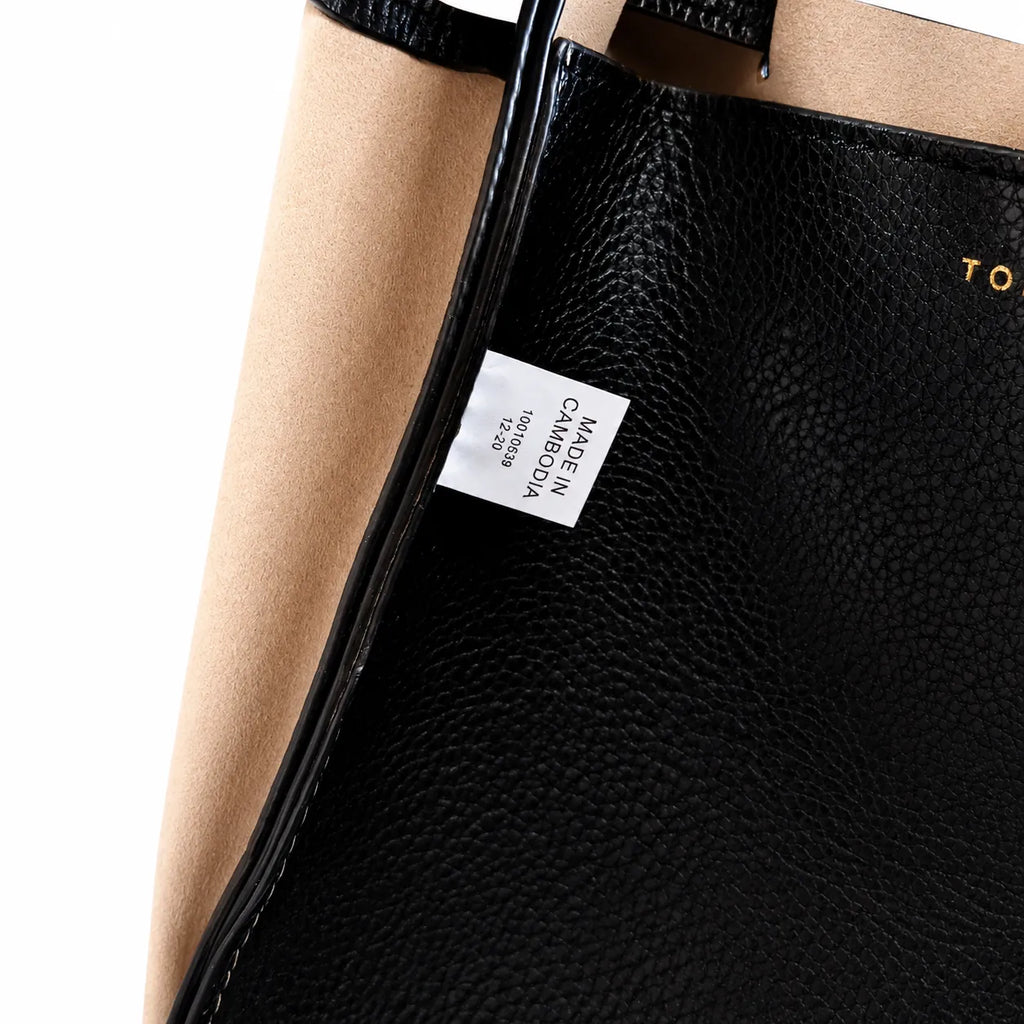 Tory Burch Romy | Black pebbled leather with adjustable shoulder strap and drawstring closure  women's designer shoulder bag