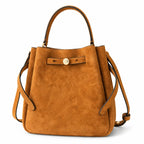 Tory Burch Romy | Caramel brown with adjustable shoulder strap and drawstring closure  women's designer suede bucket bag