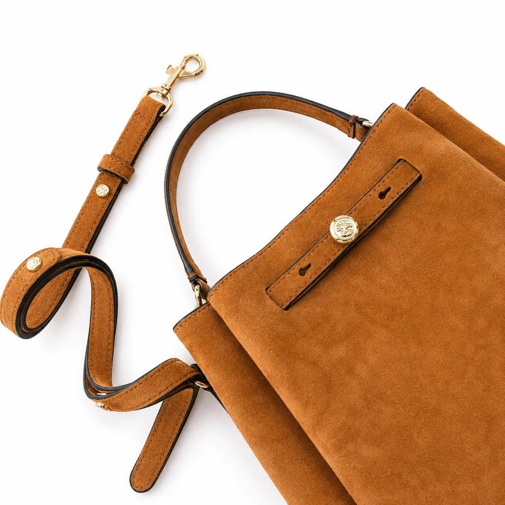 Tory Burch Romy | Caramel brown with adjustable shoulder strap and drawstring closure  women's designer suede bucket bag