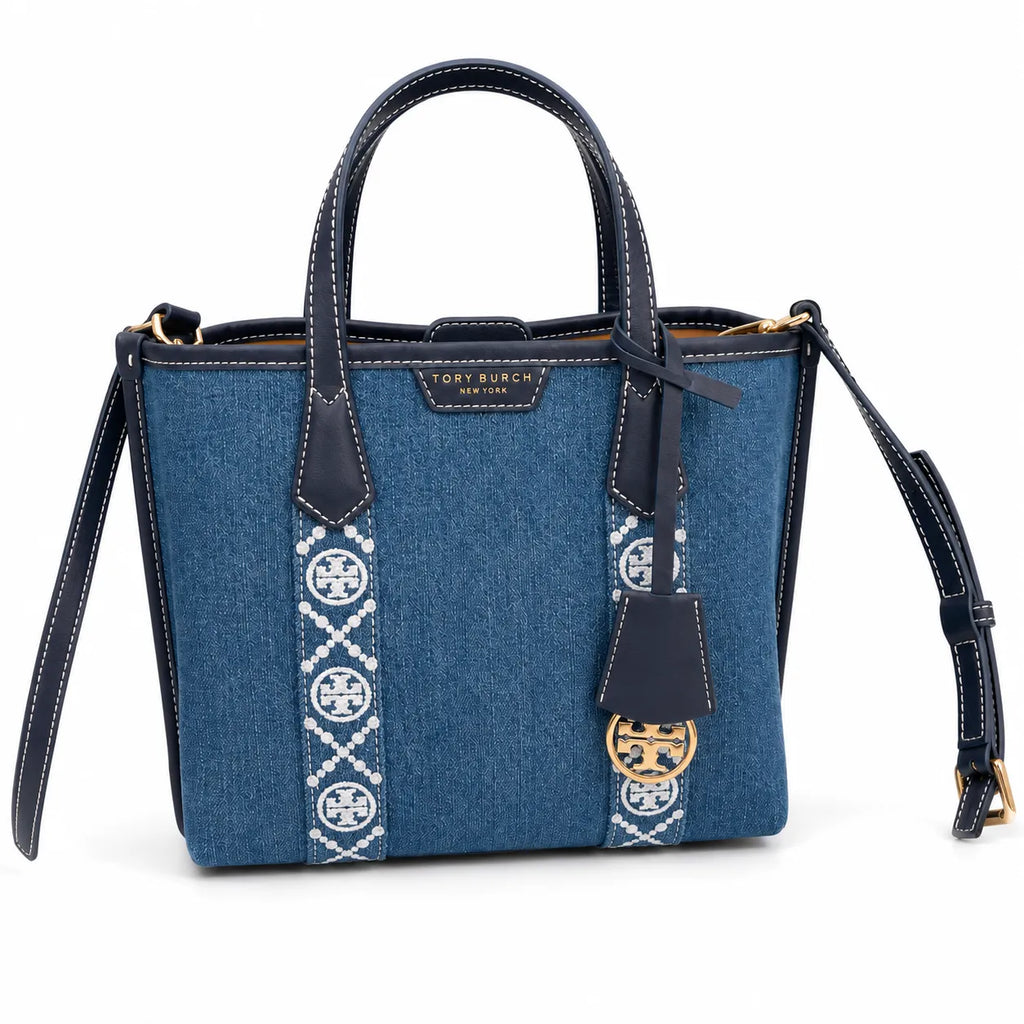 Tory Burch Perry | Blue washed denim  white embroidered T-logo stripes  navy leather trim and gold charm  double handles and adjustable shoulder strap  women's designer shoulder bag
