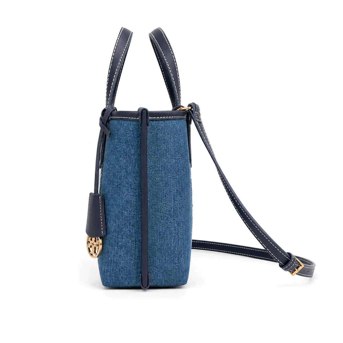 Tory Burch Perry | Blue washed denim  white embroidered T-logo stripes  navy leather trim and gold charm  double handles and adjustable shoulder strap  women's designer shoulder bag