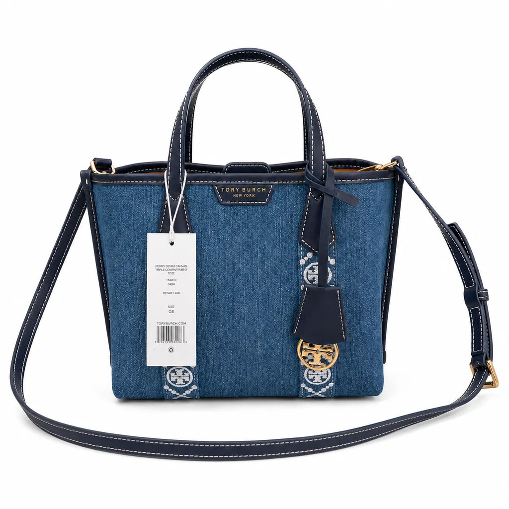 Tory Burch Perry | Blue washed denim  white embroidered T-logo stripes  navy leather trim and gold charm  double handles and adjustable shoulder strap  women's designer shoulder bag