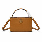 Tory Burch McGraw | Caramel-colored pebbled leather with a gold double T logo double handles and an adjustable shoulder strap women's designer handbag