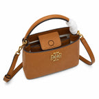 Tory Burch McGraw | Caramel-colored pebbled leather with a gold double T logo double handles and an adjustable shoulder strap women's designer handbag