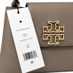 Tory Burch Britten | Grey-brown pebbled leather with gold double T logo  adjustable shoulder strap  women's designer handbag