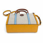Tory Burch Blake | Off-white canvas with mustard yellow and sky blue leather trim iconic double T logo detachable shoulder strap women's designer handbag