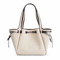 Tory Burch Romy | Off-white women's designer handbag with brown leather trim and drawstring closure adorned with the iconic double-T logo