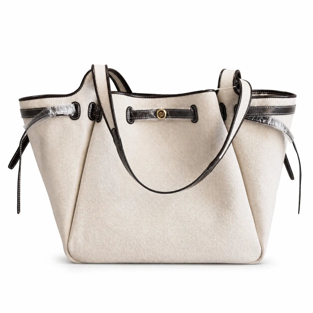 Tory Burch Romy | Off-white women's designer handbag with brown leather trim and drawstring closure adorned with the iconic double-T logo