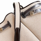 Tory Burch Romy | Off-white women's designer handbag with brown leather trim and drawstring closure adorned with the iconic double-T logo