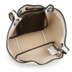 Tory Burch Romy | Off-white women's designer handbag with brown leather trim and drawstring closure adorned with the iconic double-T logo