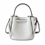 Tory Burch Romy | Light grey pebbled leather with signature logo buckle  adjustable shoulder strap  women's designer handbag
