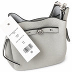 Tory Burch Romy | Light grey pebbled leather with signature logo buckle  adjustable shoulder strap  women's designer handbag