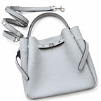 Tory Burch Romy | Light grey pebbled leather with signature logo buckle  adjustable shoulder strap  women's designer handbag