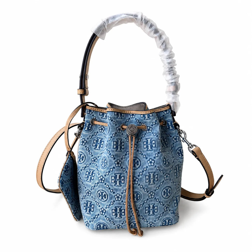 Tory Burch T Monogram | Powder blue washed denim with brown leather trim signature double T drawstring closure women's designer handbag