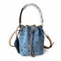 Tory Burch T Monogram | Powder blue washed denim with brown leather trim signature double T drawstring closure women's designer handbag