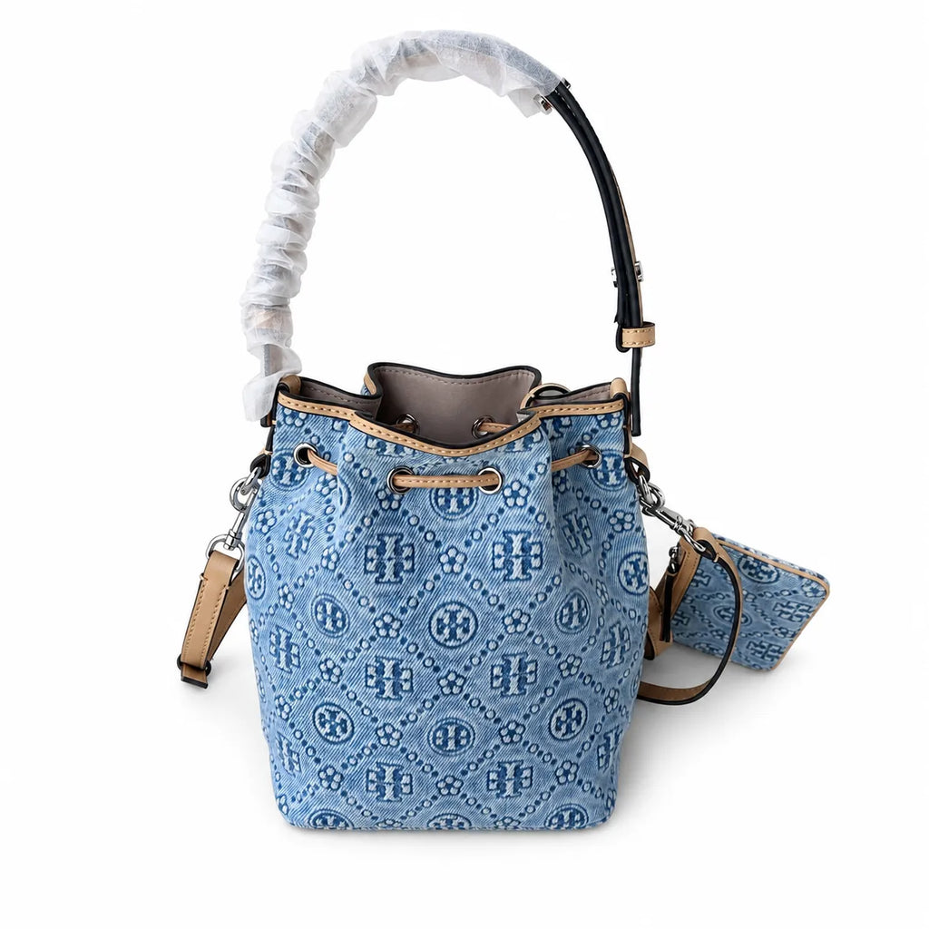 Tory Burch T Monogram | Powder blue washed denim with brown leather trim signature double T drawstring closure women's designer handbag