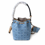 Tory Burch T Monogram | Powder blue washed denim with brown leather trim signature double T drawstring closure women's designer handbag