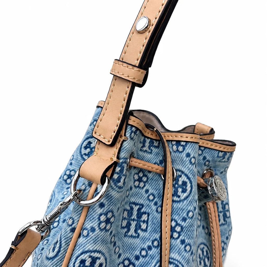 Tory Burch T Monogram | Powder blue washed denim with brown leather trim signature double T drawstring closure women's designer handbag
