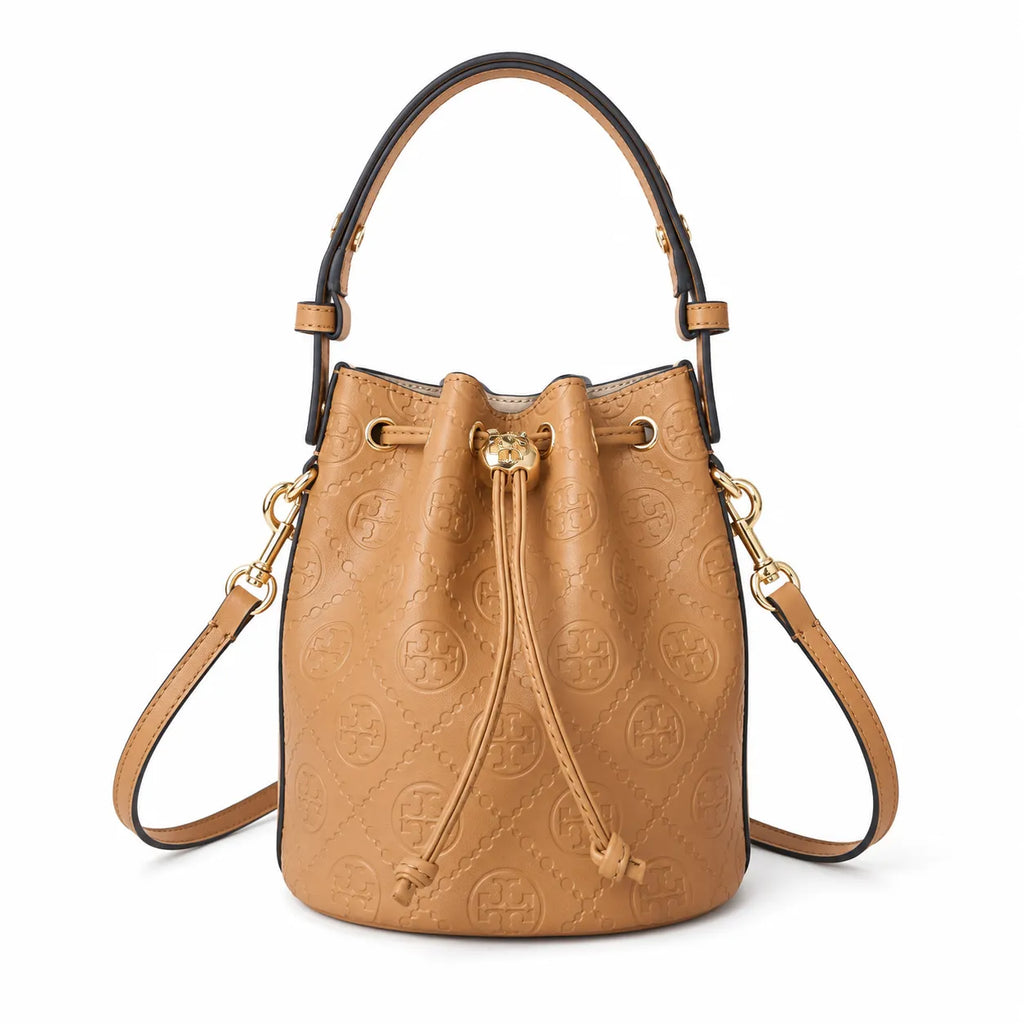 Tory Burch T Monogram | Tan pebbled leather with embossed logo  gold drawstring closure  women's designer handbag