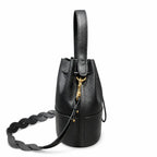 Tory Burch Miller | Black pebbled leather with a gold double-T logo  woven shoulder strap drawstring closure  women's designer