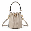 Tory Burch T Monogram | Grey-brown embossed logo gold drawstring closure adjustable shoulder strap women's designer handbag