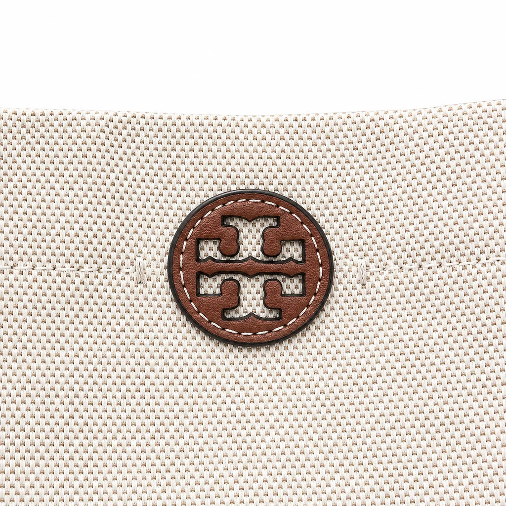 Tory Burch Blake | Off-white woven fabric with brown leather trim  iconic double-T logo   adjustable shoulder strap  women's designer handbag