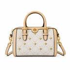 Tory Burch T Monogram | Ivory canvas with tan leather trim  gold heart studs and double T logo adjustable shoulder strap   women's designer handbag