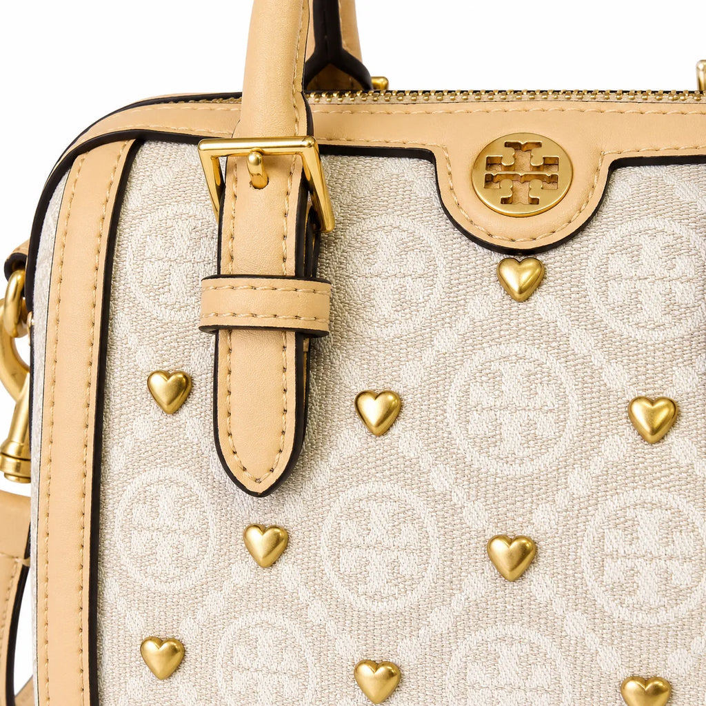 Tory Burch T Monogram | Ivory canvas with tan leather trim  gold heart studs and double T logo adjustable shoulder strap   women's designer handbag
