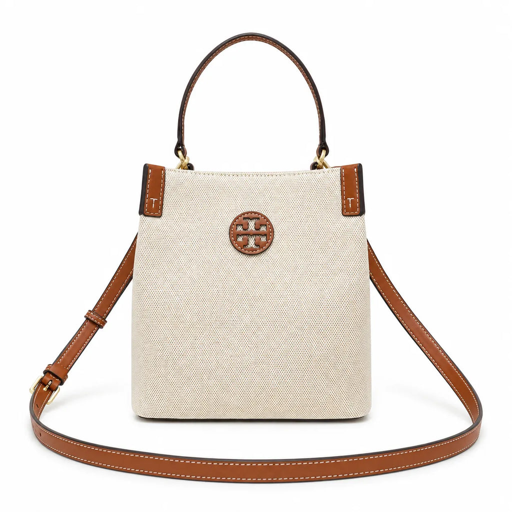 Tory Burch Blake | A women's designer handbag in beige canvas and brown leather with a detachable shoulder strap and top handle offering multiple carrying options