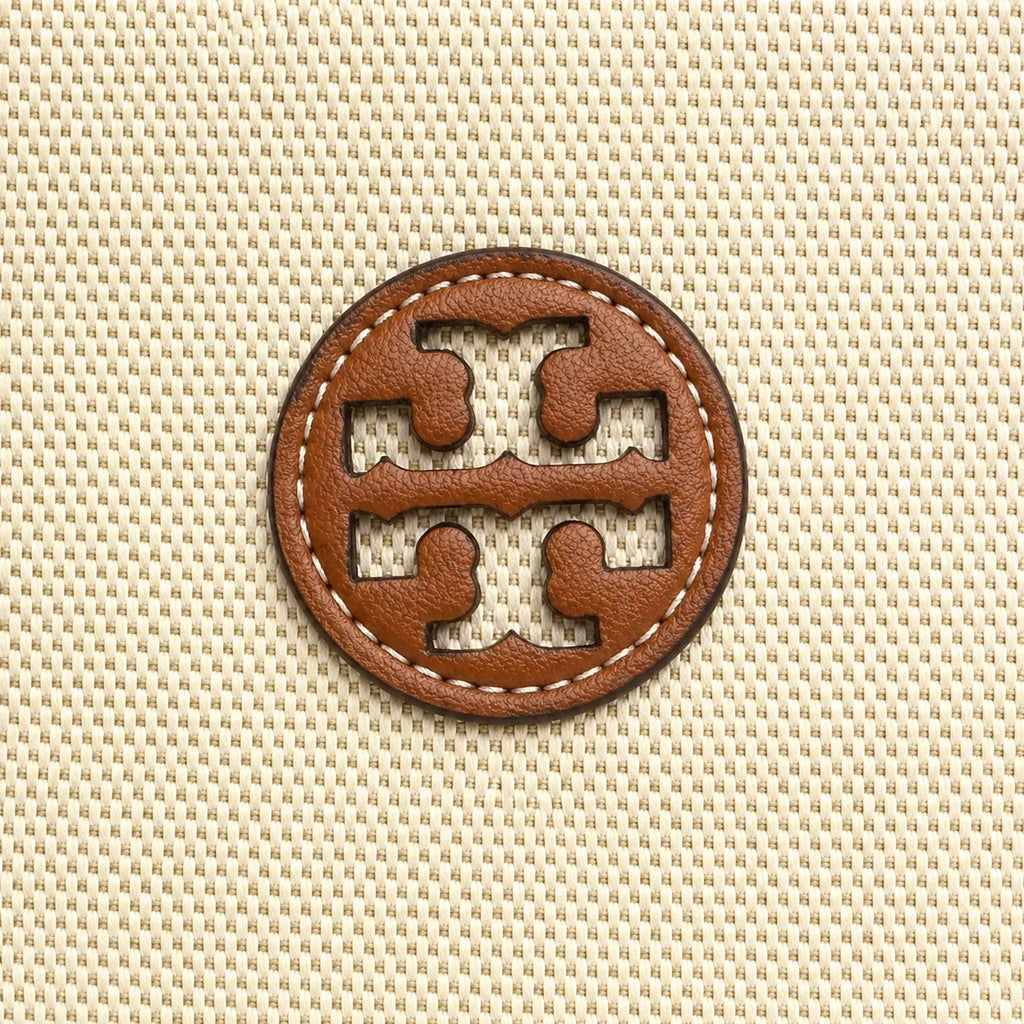 Tory Burch Blake | A women's designer handbag in beige canvas and brown leather with a detachable shoulder strap and top handle offering multiple carrying options