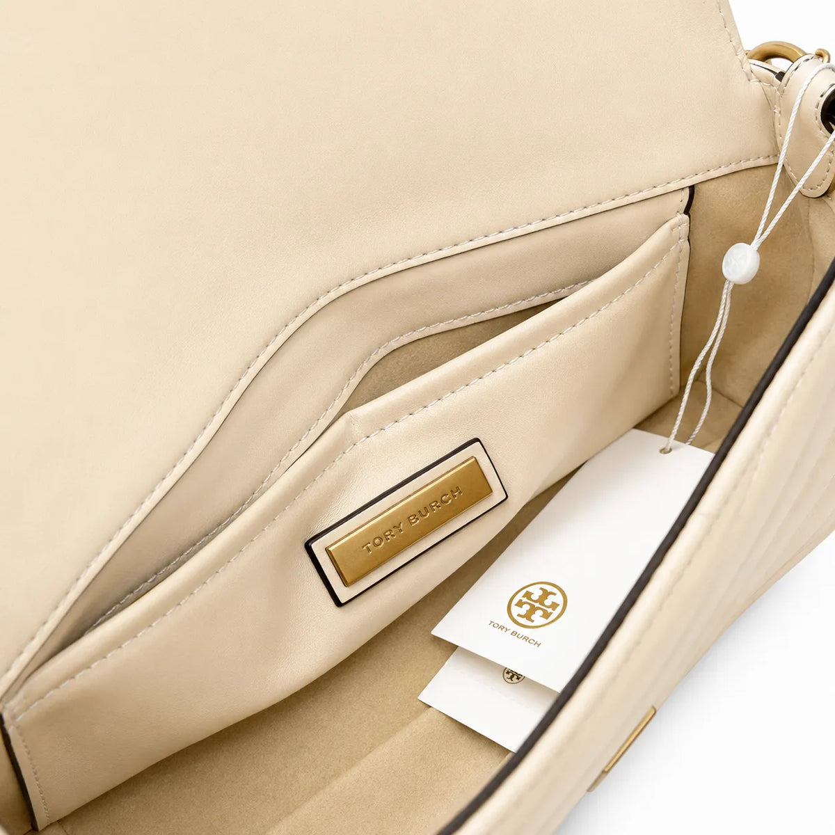 Tory Burch Kira Chevron | Off-white soft lambskin herringbone stitching detachable chain multiple carrying options women's designer handbag