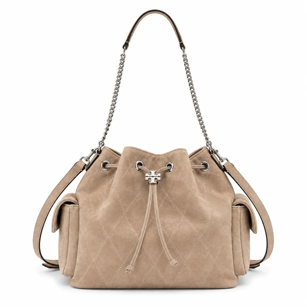 Tory Burch Charlie | Light brown soft suede with diamond stitching drawstring closure and detachable chain A women's designer quilted suede bucket bag offering multiple carrying options