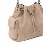 Tory Burch Charlie | Light brown soft suede with diamond stitching drawstring closure and detachable chain A women's designer quilted suede bucket bag offering multiple carrying options