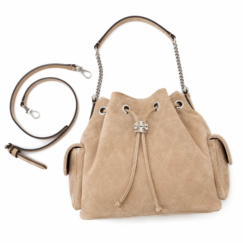Tory Burch Charlie | Light brown soft suede with diamond stitching drawstring closure and detachable chain A women's designer quilted suede bucket bag offering multiple carrying options
