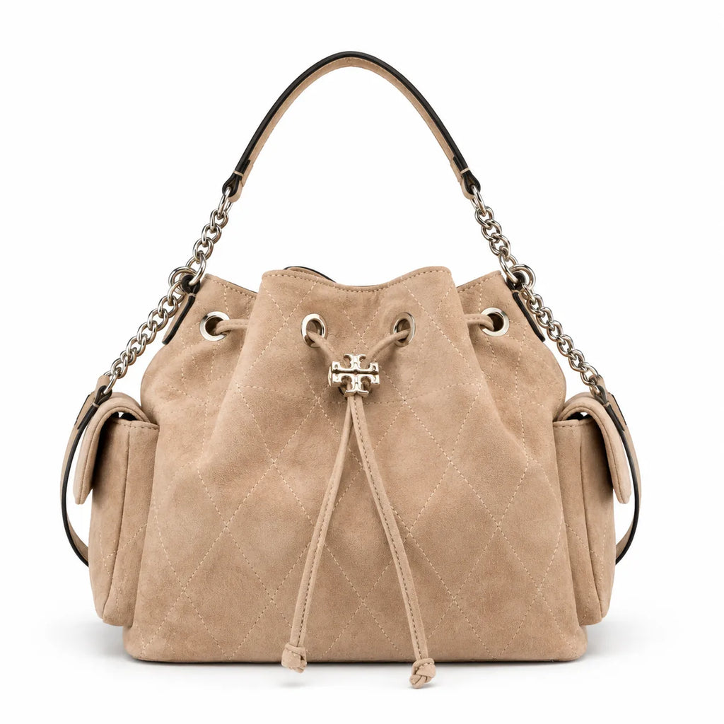 Tory Burch Charlie | Light brown soft suede with diamond stitching drawstring closure and detachable chain A women's designer quilted suede bucket bag offering multiple carrying options