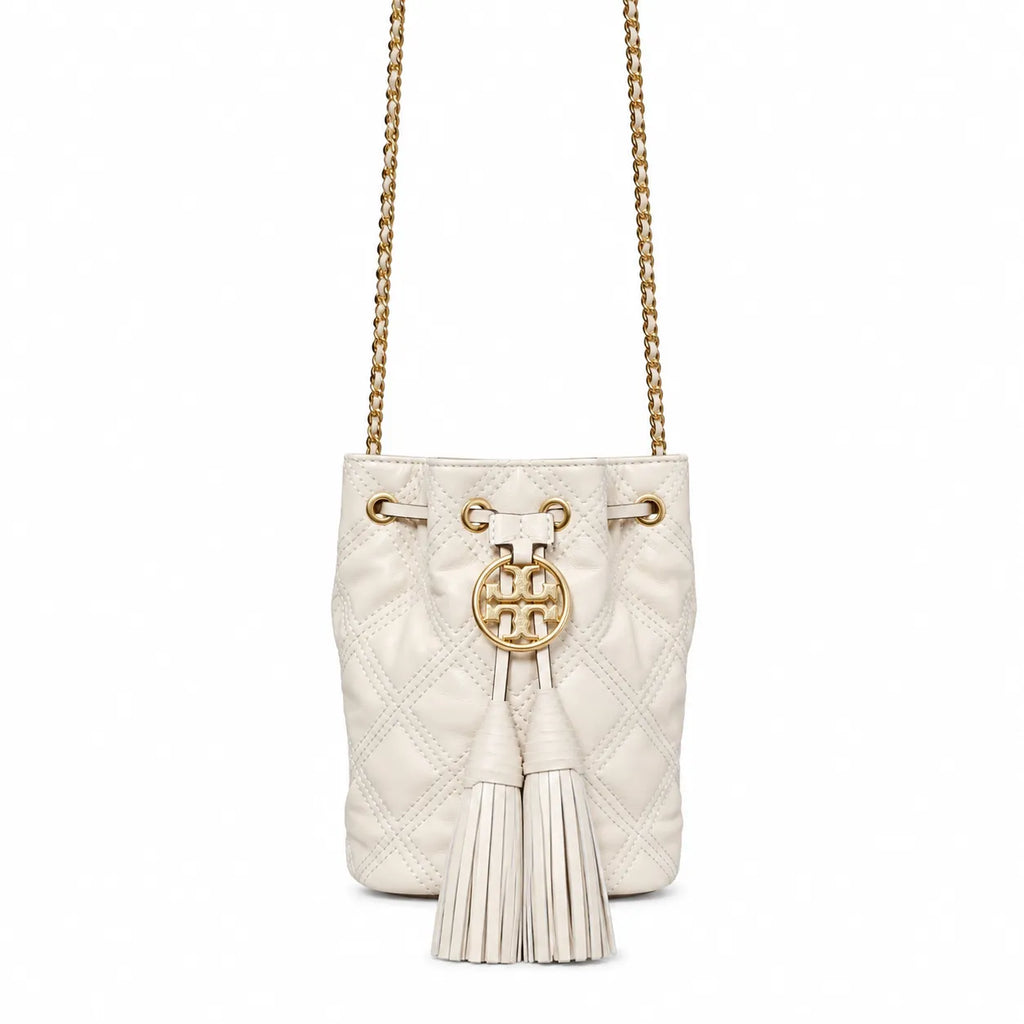 Tory Burch Fleming off-white quilted lambskin with gold logo and tassels  comes with an adjustable chain shoulder strap for multiple carrying options a women's designer handbag