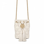 Tory Burch Fleming off-white quilted lambskin with gold logo and tassels  comes with an adjustable chain shoulder strap for multiple carrying options a women's designer handbag
