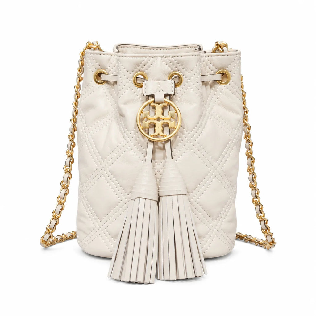 Tory Burch Fleming off-white quilted lambskin with gold logo and tassels  comes with an adjustable chain shoulder strap for multiple carrying options a women's designer handbag